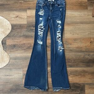 Vintage Blue Flare Jeans with Distressed Detailing 25x36